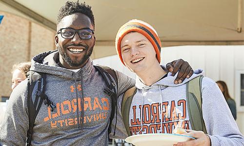 Two students smiling for a photo